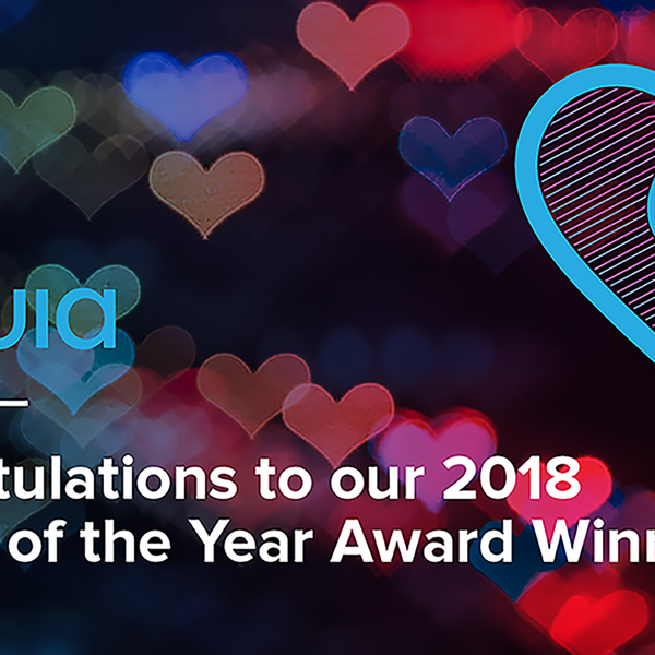 Acquia logo in a dark background full of colorfull hearts