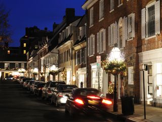 City at night with cars parked on the street
