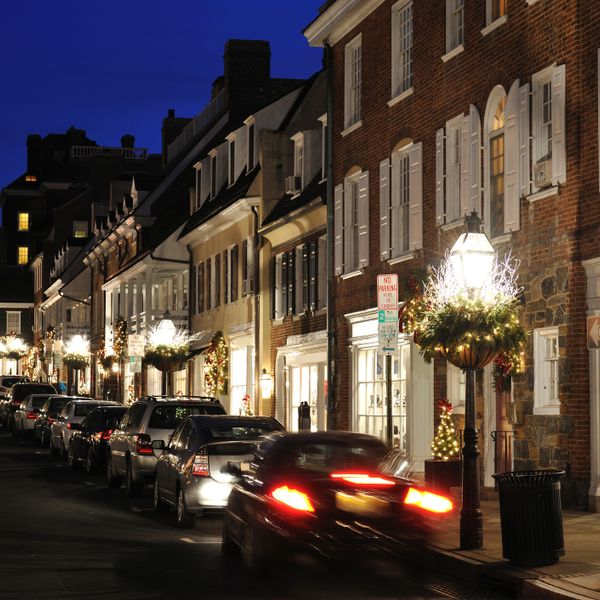 City at night with cars parked on the street