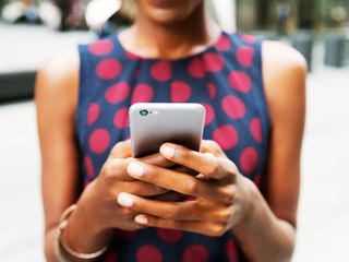 Close up of a person holding a smartphone