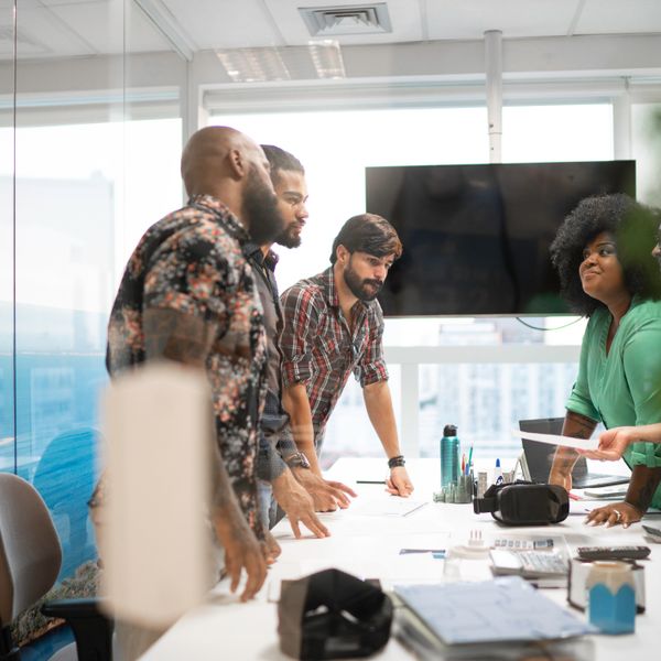 Diverse business team discussing plans during business meeting