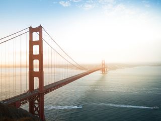 Golden Gate bridge in daylight and blue sky with a few clouds