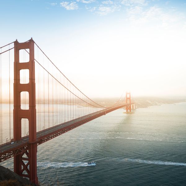 Golden Gate bridge in daylight and blue sky with a few clouds