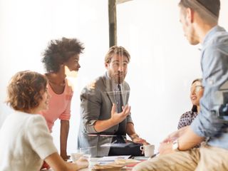 Group of people discussing in office