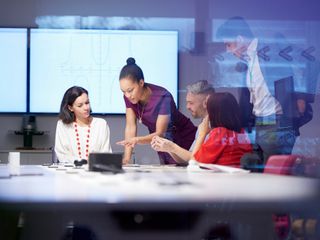 Group of people having meeting in a room