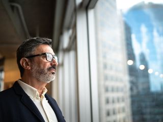 Man looking out of window