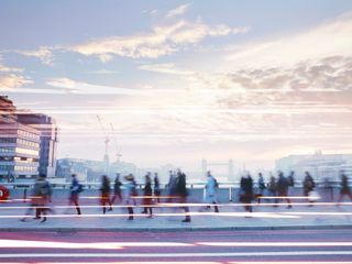 People walking around the city at dawn
