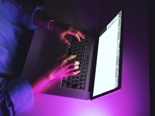 Person using laptop late at night