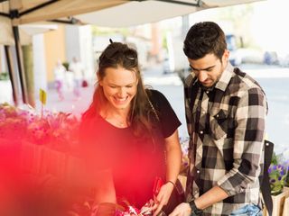 Woman and man shopping at flower market