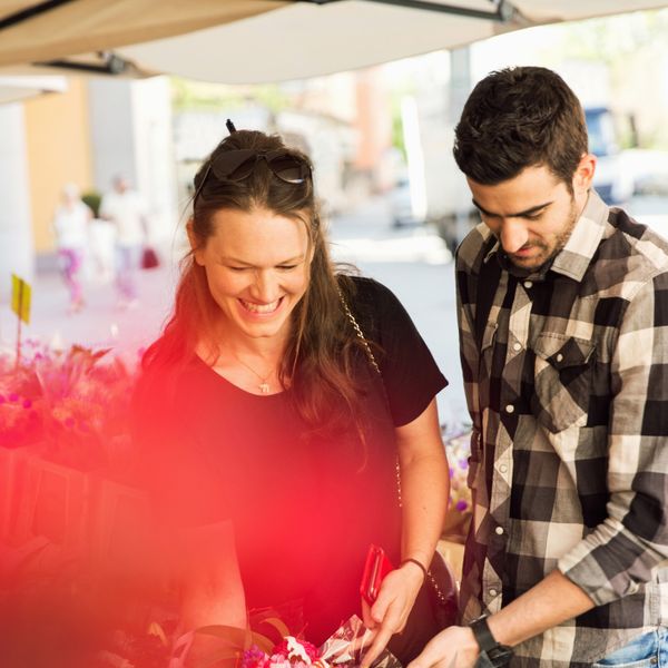 Woman and man shopping at flower market