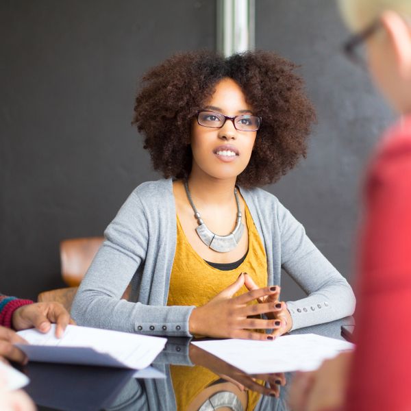 Woman discussing with her colleagues during a meeting
