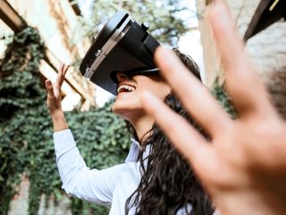 Woman smiling with virtual reality glasses headset