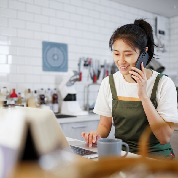 Woman working and talking on cell phone
