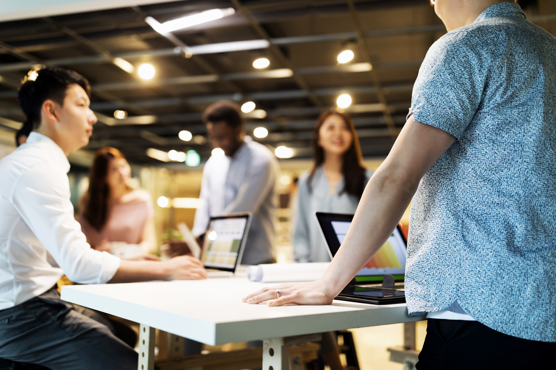 Group of people working around a table