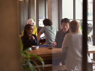People having informal meeting in co working space