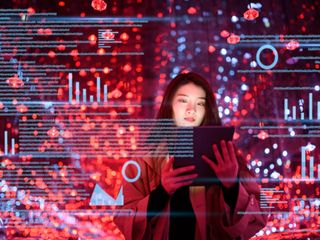 women on a tablet with charts imposed on the background