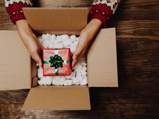 People opening a present at holiday season
