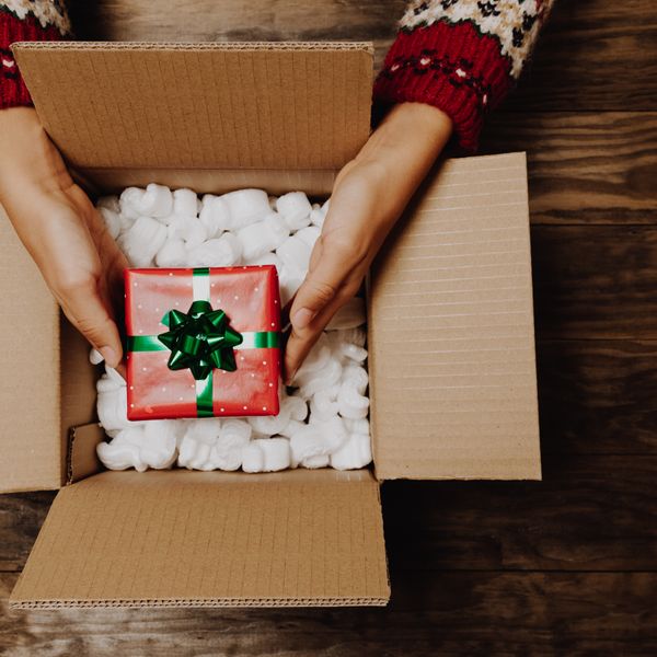 People opening a present at holiday season