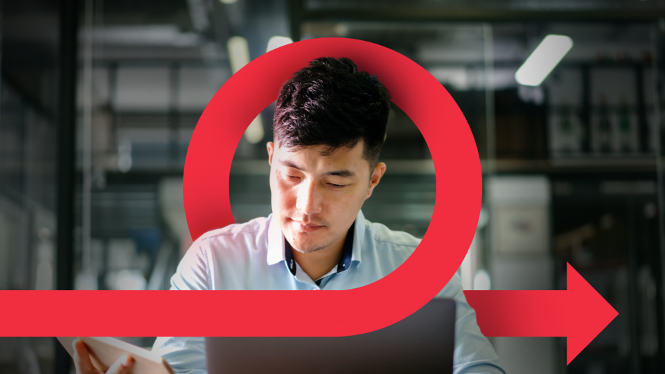 a man looking at computer screen inside an arrow