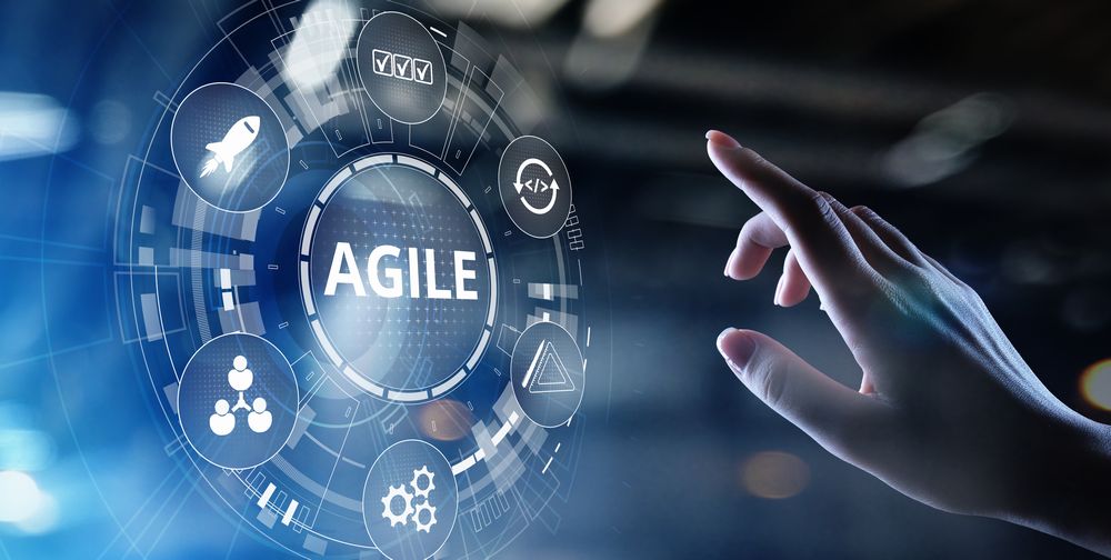 agile in the digital screen and a hand about to touch
