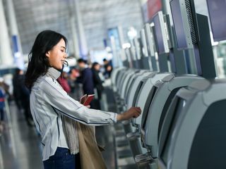 a woman checking in at the airport