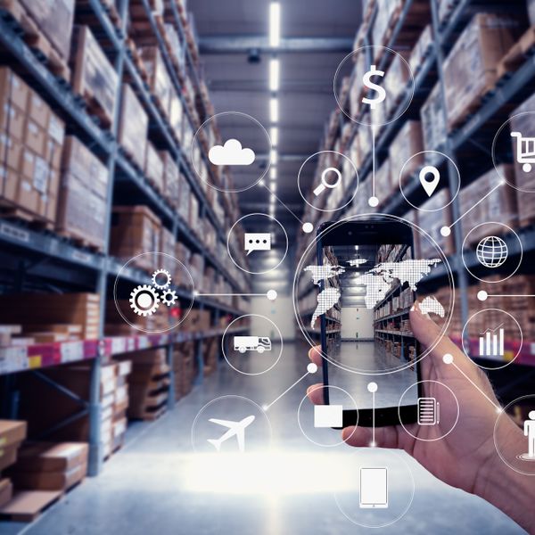 a smartphone and icons in a warehouse