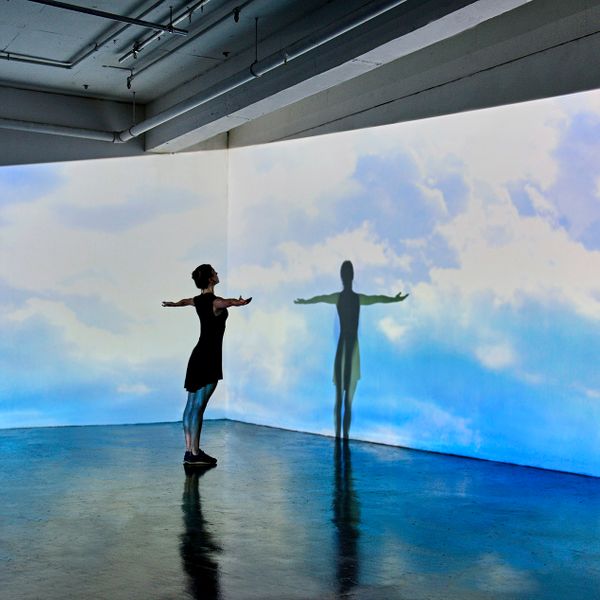 woman looking to her shadow as a inspiration