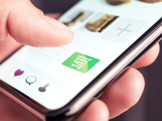 hand touching on cart icon on smartphone