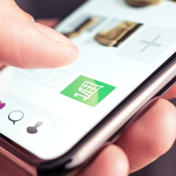 hand touching on cart icon on smartphone