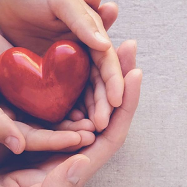 Hands holding a heart shaped object