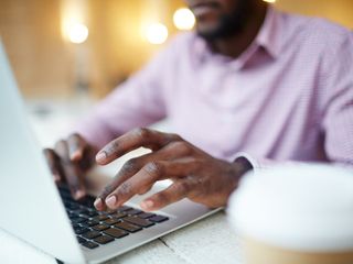 Man typing on laptop