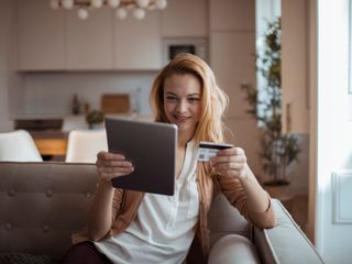 Woman online shopping on her tablet