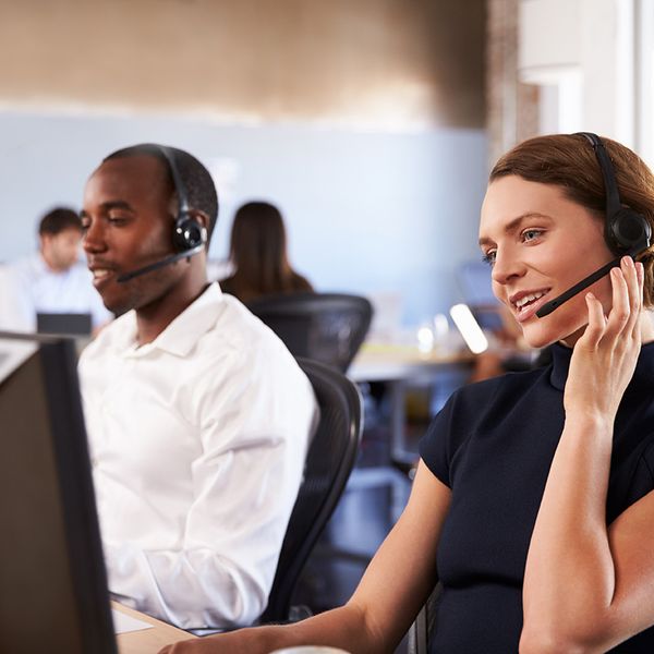 Man and woman in front of computer