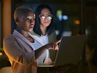 Two women in front of a computer