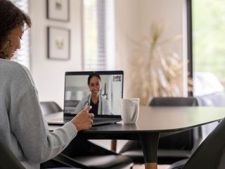 Woman and doctor talking remotely via a video call