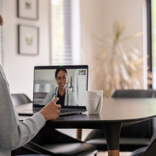 Woman and doctor talking remotely via a video call
