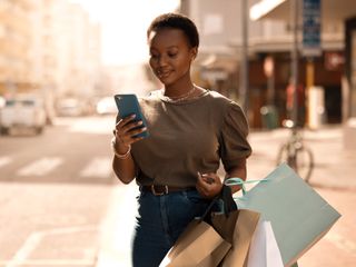 attractive young woman using her cellphone  