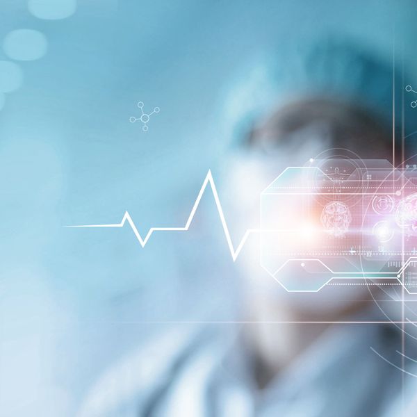 a medical professional looking at a digital dashboard