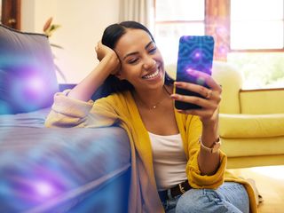 Woman smilling, having a great experience using her cellphone