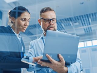 two people using laptop and use the application