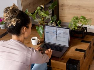 woman looking at biil on screen