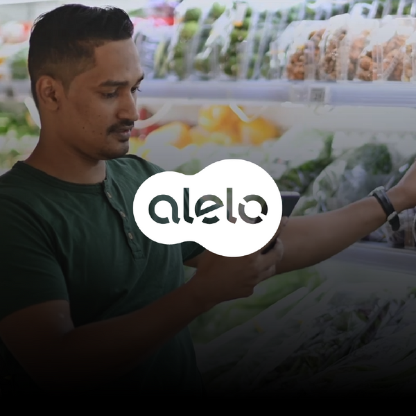 man in a wheelchair choosing vegetables at the supermarket