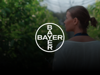 Woman at a greenhouse holding a tablet 