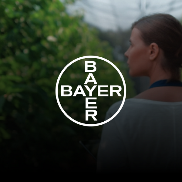 Woman at a greenhouse holding a tablet 