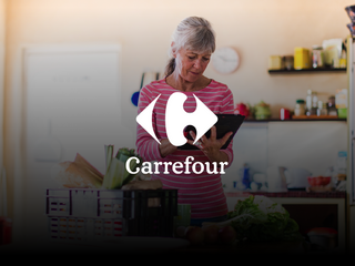 woman at the kitchen checking groceries her on tablet
