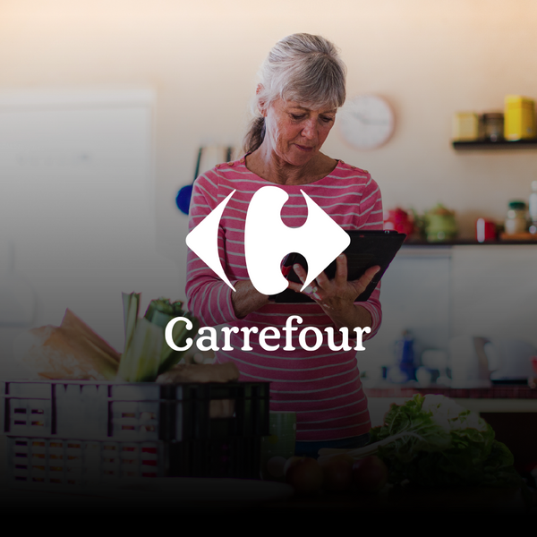 woman at the kitchen checking groceries her on tablet