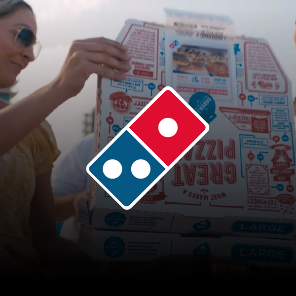 A woman and a man sharing a Dominos pizza