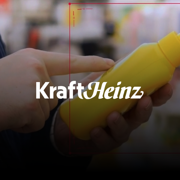 Person holding a bottle of mustard at the supermarket