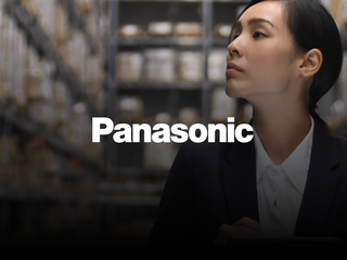 Asian woman at a warehouse using a tablet