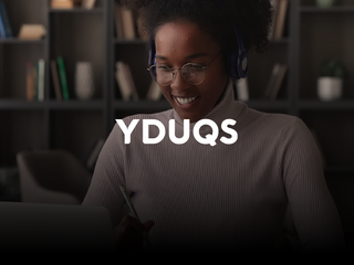 A black woman studying on her computer